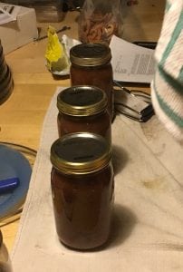 apple butter preserved in glass jars